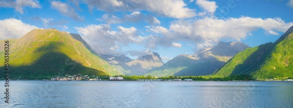 Fototapeta Norway. Nature in fjords. High mountains and reflections. Panoramic view. Clouds over the rocks. Vacation and travel in summer Norway. Background, wallpaper, postcards.
