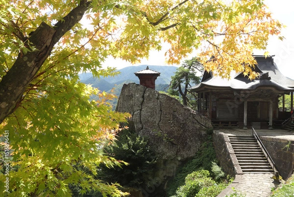 Obraz Yamadera temple at the beginning of fall with yellow maple leafs