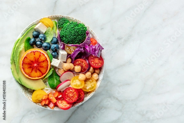 Fototapeta Buddha Bowl. Rainbow salad. Vegan poke bowl with avocado. Healthy food. Overhead flat lay shot with copy space