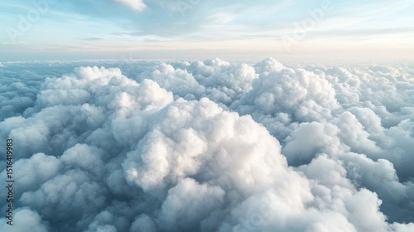 Fototapeta A stunning aerial view of soft, fluffy clouds in a vibrant blue sky, inviting feelings of freedom, peace, and tranquility while illustrating the beauty of nature's canvas.