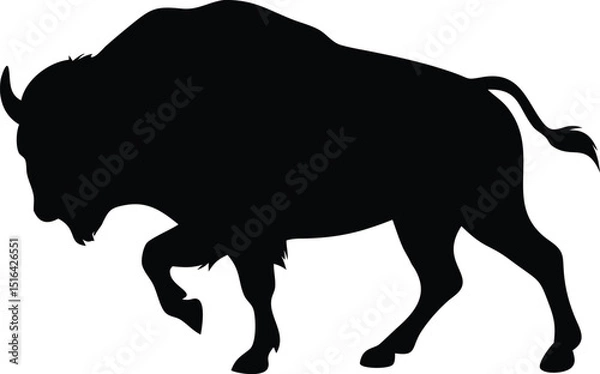 Fototapeta Powerful black bison silhouette in a charging pose ready for action depicted with great artistic flair