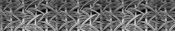 Fototapeta Abstract vine texture. The texture formed by the interweaving of thin vine rods. Template for interior design, websites or promotional materials. Banner for insertion into site.