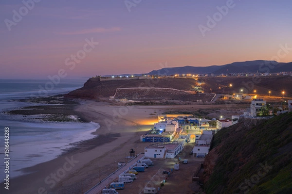Fototapeta Calm evening in Sidi Ifni, Morocco with coastal views and soft twilight lighting
