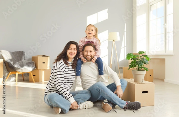 Fototapeta Family enjoys moving new apartment, happy mother, father, cute child near cardboards, excited homebuyer transporting boxes, organizing new home move, changing residence for better, independence