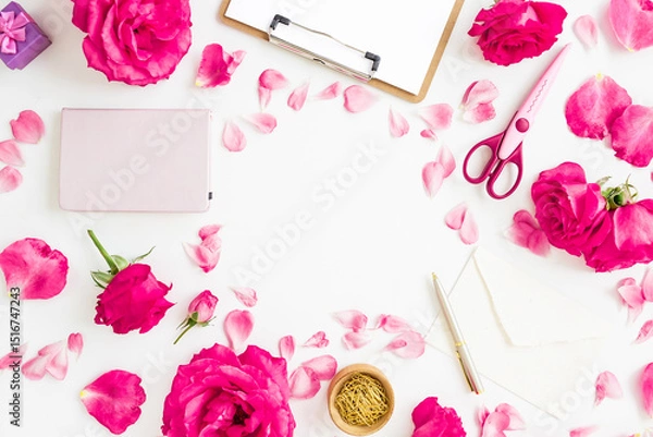Fototapeta Creative workspace flat lay with roses, petals, notebook, scissors, and envelope on white background.