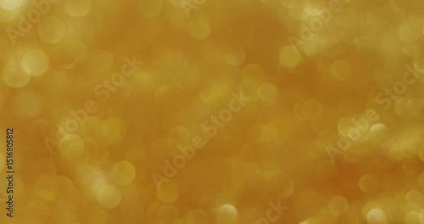 Fototapeta Abstract background. The golden sequins are bubbling and shimmering. Blurred boho sequins