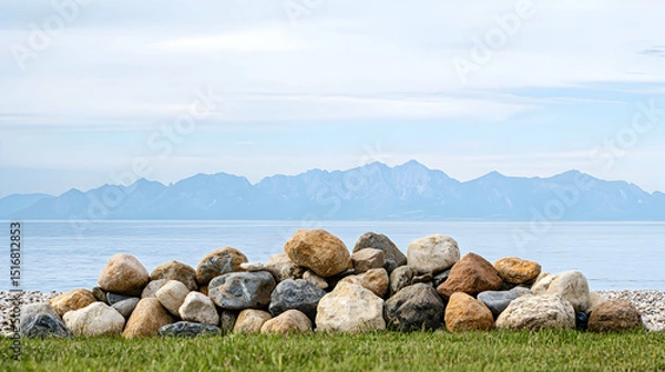 Obraz Coastal Rocks Pile Against Mountainscape
