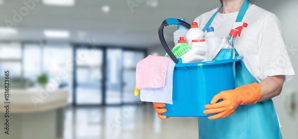 Fototapeta Cleaning service worker prepares for daily tasks