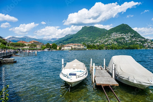 Obraz Tourist boat in Lugano lake and Lugano city in canton of Ticino in Switzerland