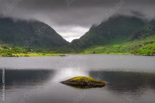 Obraz A tranquil and peaceful mountain lake, nestled within vibrant greenery of Gap of Dunloe, and under dramatic, fluffy clouds, beautifully capturing the serene beauty of nature, Kerry, Ireland