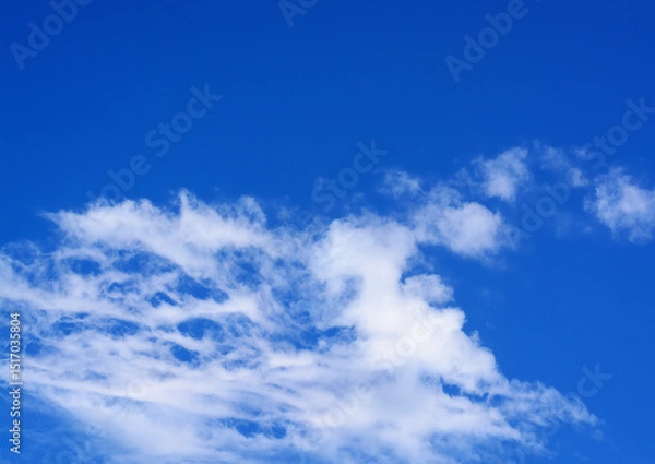 Obraz Background with a blue sky and light cirrus clouds, with copy space