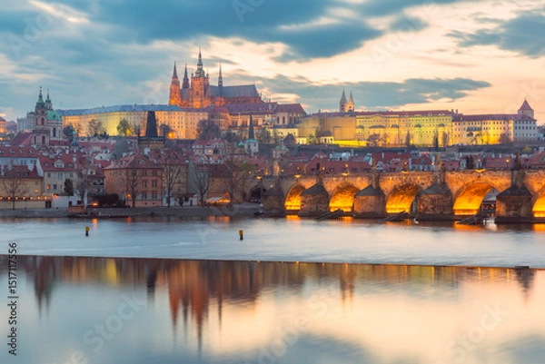 Fototapeta Sunset view of Vltava River with Charles Bridge and landmarks in Prague Czech Republic