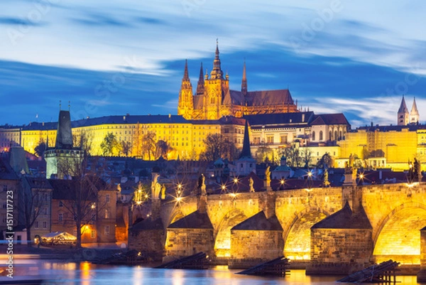 Fototapeta Illuminated St Vitus Cathedral and Charles Bridge at night in Prague Czech Republic