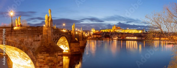 Fototapeta Night view of Charles Bridge with statues and lights in Prague Czech Republic