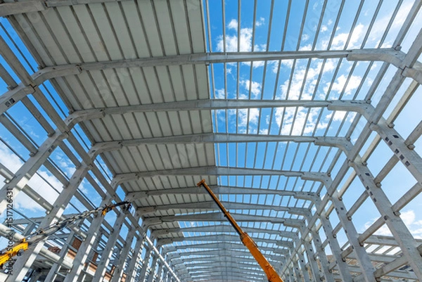Obraz Covering is being done on precast roof. Interior view of the walls, supports, and roof of a precast commercial industrial prefabricated concrete. It is a construction product.