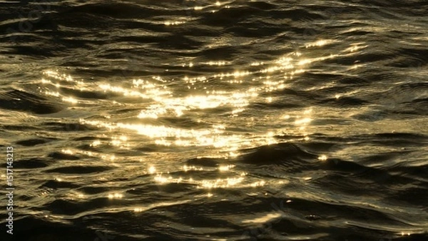 Obraz The drone captures a mystical scene where golden light radiates off the ocean’s surface, transforming the water into a breathtaking spectacle of color and light.

