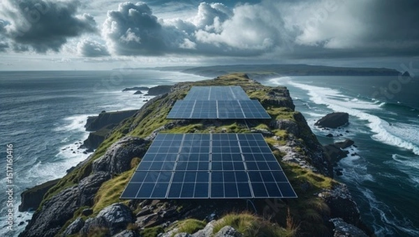 Obraz Solar panels on a cliffside capture the energy of the sun over a vast ocean view.