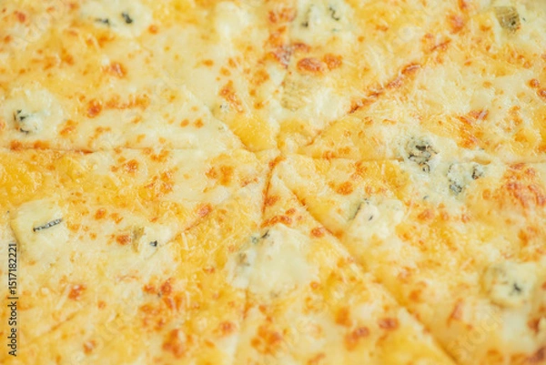 Fototapeta Four cheese pizza as a background macro photo.