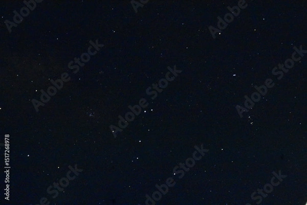 Fototapeta A vast, dark night sky filled with numerous stars, offering a serene celestial view.