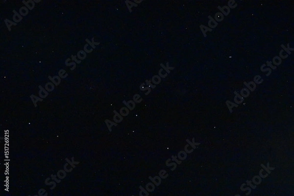 Fototapeta A vast, dark night sky filled with numerous stars, offering a serene celestial view.