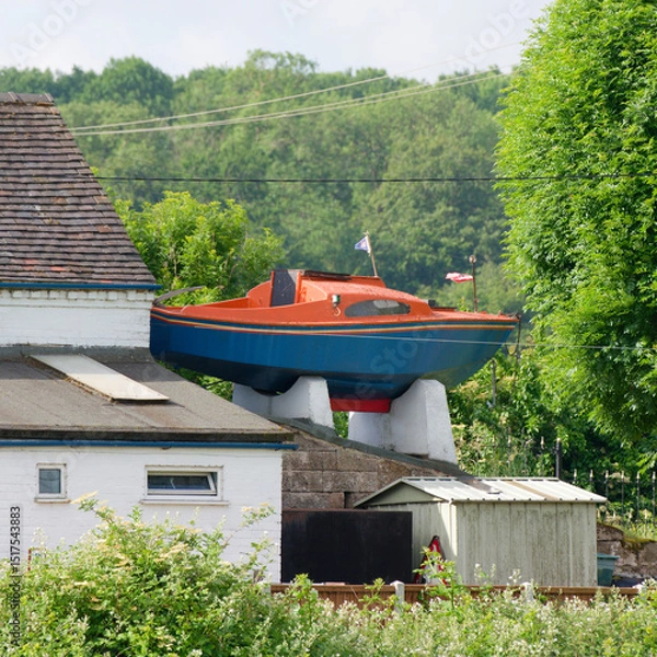 Fototapeta Small lifeboat on a building