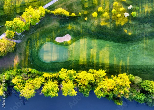 Obraz Aerial view drone shot of beautiful green golf field. Banner panorama background
