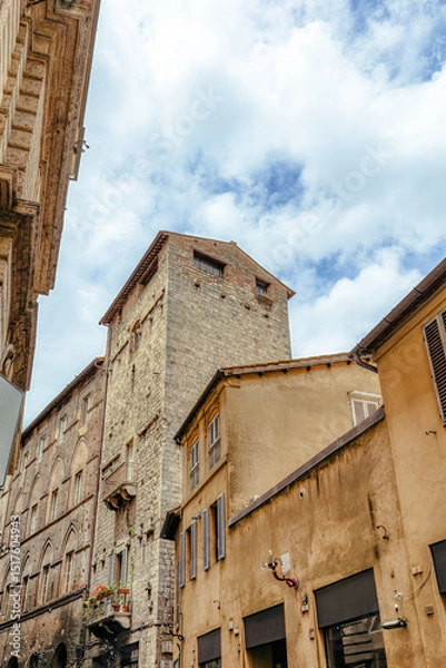 Fototapeta The historic streets of Siena are a showcase of medieval architecture and cozy, cobbled pathways. Located in the region of Tuscany in Italy, this city provides a unique experience for visitors.