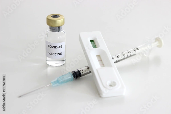 Obraz Vial of Covid-19 vaccine, 1 ml plastic syringe with needle and Positive test result of Covid-19 antigen test kit isolated on the white background