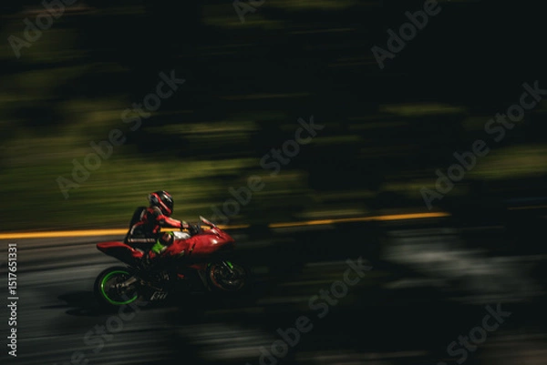 Fototapeta red racing bike through the trees