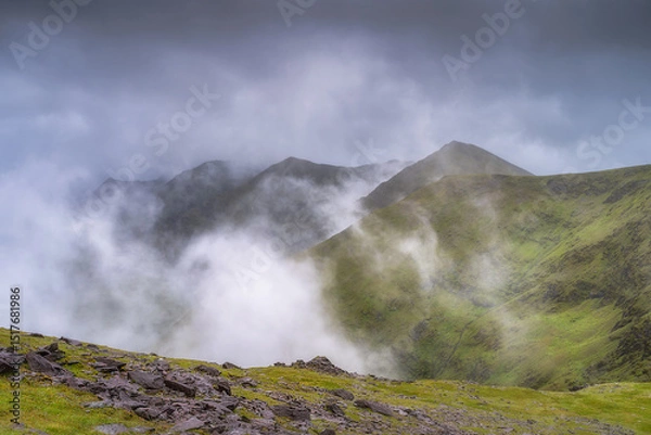 Obraz A breathtaking and stunning view of magnificent, misty Carrauntoohil mountain that are covered entirely in vibrant and lush greenery, creating a serene and tranquil atmosphere, Kerry, Ireland