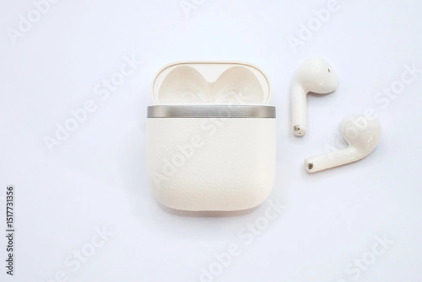 Fototapeta Wireless earbuds with charging case, sleek design and modern style