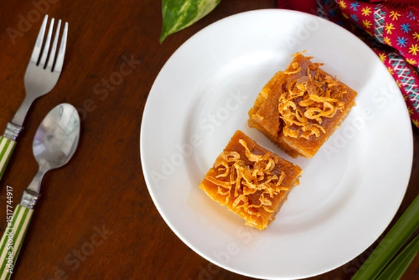 Fototapeta Thai mung bean custard or Thai custard cake on the wooden table.
