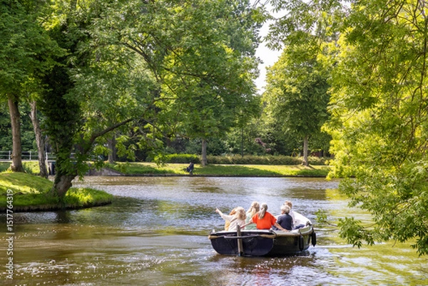 Fototapeta Group of female friends sailing the city canals in a sloop on a beautiful sunny day in Leiden in South-Holland The Netherlands