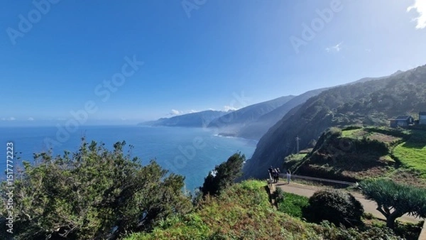 Fototapeta The coastal cliffs of Madeira Island offer breathtaking lookouts overlooking the vast Atlantic Ocean, where rugged rock formations meet endless blue waters. These viewpoints provide visitors with stun