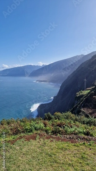 Fototapeta The coastal cliffs of Madeira Island offer breathtaking lookouts overlooking the vast Atlantic Ocean, where rugged rock formations meet endless blue waters. These viewpoints provide visitors with stun