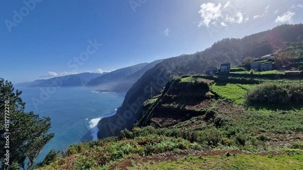 Fototapeta The coastal cliffs of Madeira Island offer breathtaking lookouts overlooking the vast Atlantic Ocean, where rugged rock formations meet endless blue waters. These viewpoints provide visitors with stun
