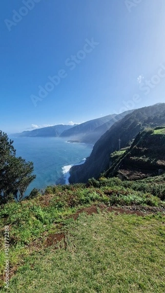 Fototapeta The coastal cliffs of Madeira Island offer breathtaking lookouts overlooking the vast Atlantic Ocean, where rugged rock formations meet endless blue waters. These viewpoints provide visitors with stun