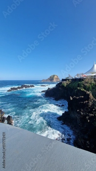 Fototapeta The Natural Pools of Porto Moniz, formed by ancient volcanic rocks, are the signature attraction of this charming coastal town in Madeira. These crystal-clear pools are naturally filled with fresh sea