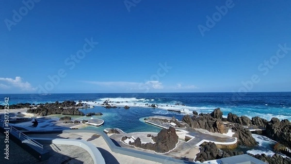 Fototapeta The Natural Pools of Porto Moniz, formed by ancient volcanic rocks, are the signature attraction of this charming coastal town in Madeira. These crystal-clear pools are naturally filled with fresh sea