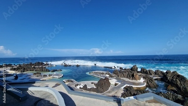 Fototapeta The Natural Pools of Porto Moniz, formed by ancient volcanic rocks, are the signature attraction of this charming coastal town in Madeira. These crystal-clear pools are naturally filled with fresh sea