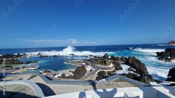 Fototapeta The Natural Pools of Porto Moniz, formed by ancient volcanic rocks, are the signature attraction of this charming coastal town in Madeira. These crystal-clear pools are naturally filled with fresh sea