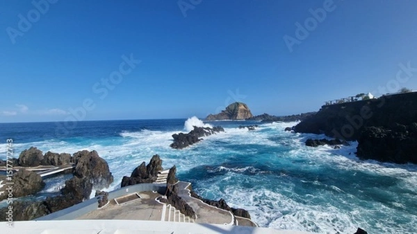 Fototapeta The Natural Pools of Porto Moniz, formed by ancient volcanic rocks, are the signature attraction of this charming coastal town in Madeira. These crystal-clear pools are naturally filled with fresh sea