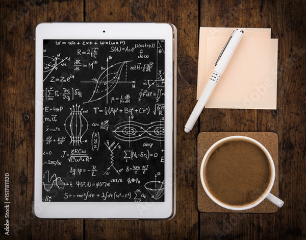Obraz Tablet with mathematical and physical formulas, pen, notebook and cup of coffee on the table. Good background for design on the theme of Science, education.