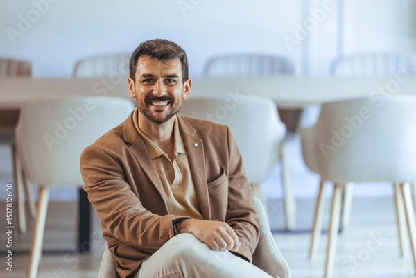 Fototapeta Professional Man Smiling in a Modern Office Environment