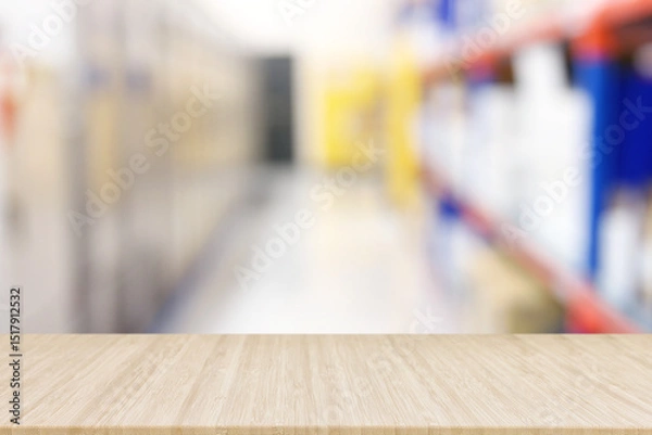 Fototapeta Empty table and industry warehouse background with bright lights