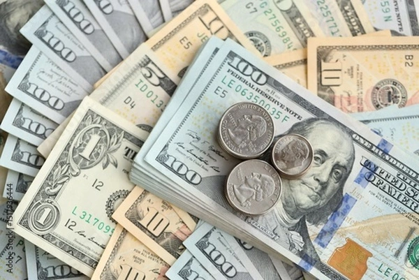 Fototapeta American US dollars money bills and coins close up in big amount