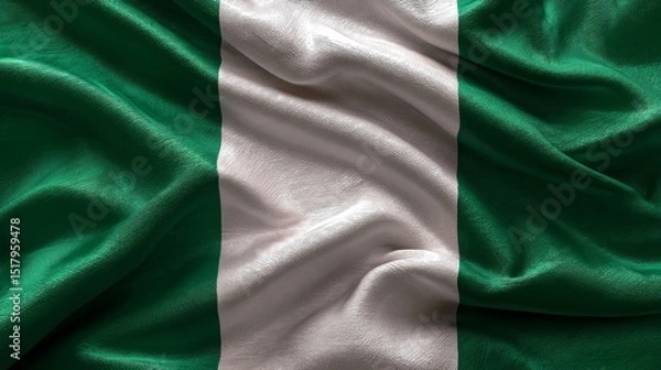 Fototapeta Celebrating nigerian independence day with a silk flag display