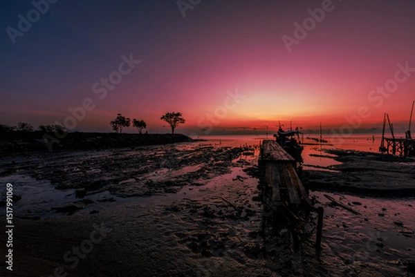 Obraz The natural background of the morning light by the sea, the local fishing pier in Ban Tha Sala, Nakhon Si Thammarat, has the beauty of the golden light of the sun.