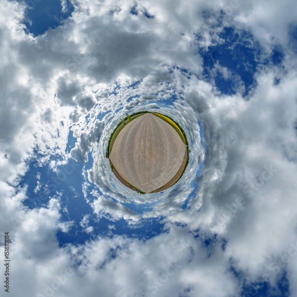 Fototapeta simple little tiny planet without buildings in blue sky with sun and beautiful clouds. Transformation of spherical panorama 360 degrees. Spherical abstract aerial view. Curvature of space.