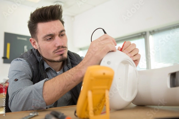 Fototapeta electrician testing appliance with multimeter